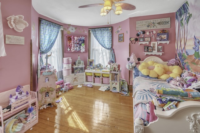 bedroom with hardwood / wood-style flooring and ceiling fan