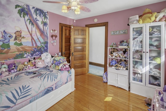 bedroom featuring ceiling fan and light hardwood / wood-style floors