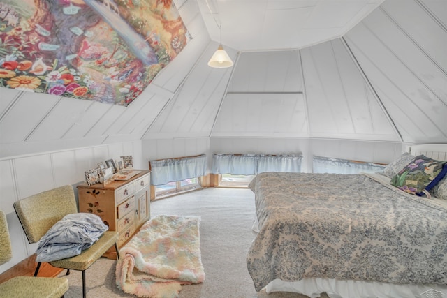 bedroom featuring light colored carpet and lofted ceiling