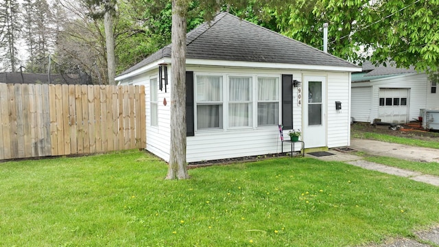 view of outdoor structure featuring a lawn