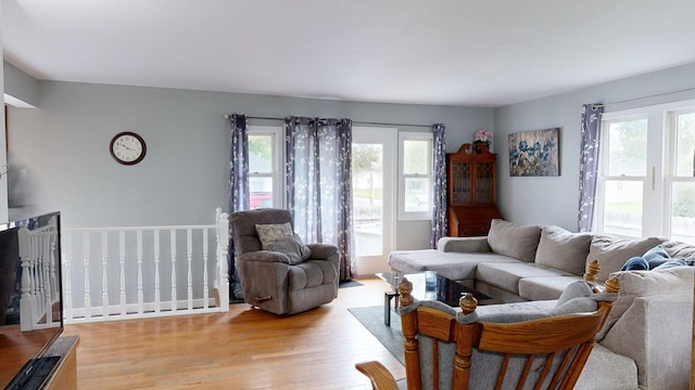 living room with plenty of natural light and light wood-type flooring