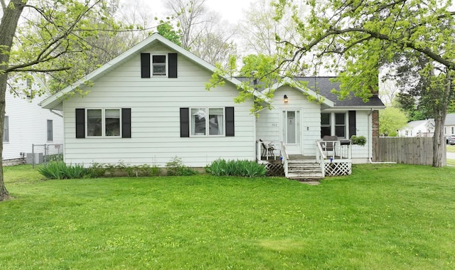 rear view of house with a lawn