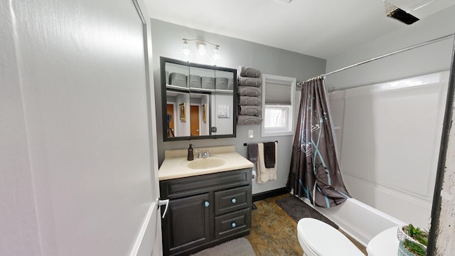 full bathroom featuring vanity, toilet, and shower / tub combo with curtain