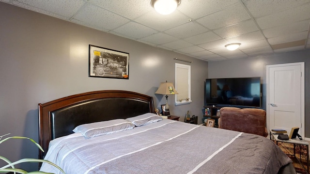 bedroom featuring a drop ceiling