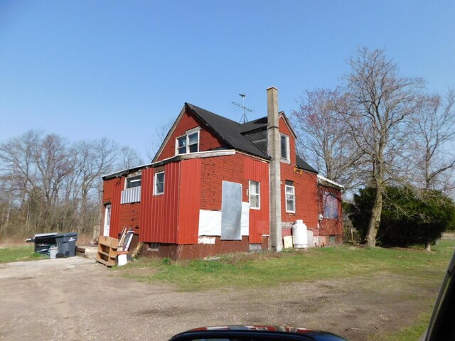 1976 Townline Rd, Benton Harbor, MI 49022 - view of side of property with a chimney and board and batten siding