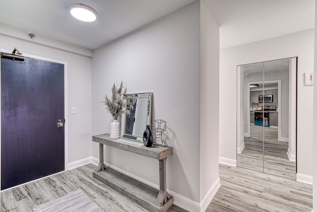 5000 Town Ctr Unit 2205, Southfield, MI 48075 - entryway featuring light wood finished floors and baseboards