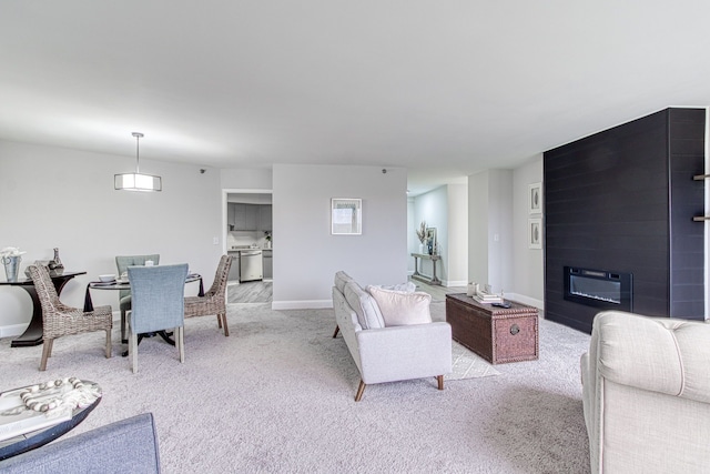 5000 Town Ctr Unit 2205, Southfield, MI 48075 - living area featuring carpet flooring, a large fireplace, and baseboards