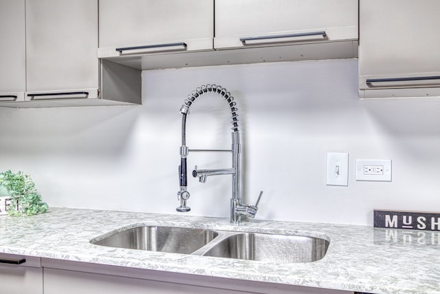 5000 Town Ctr Unit 2205, Southfield, MI 48075 - kitchen view of a sink and light stone counters