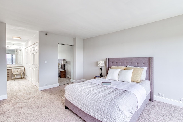 5000 Town Ctr Unit 2205, Southfield, MI 48075 - bedroom with multiple closets, light carpet, and baseboards