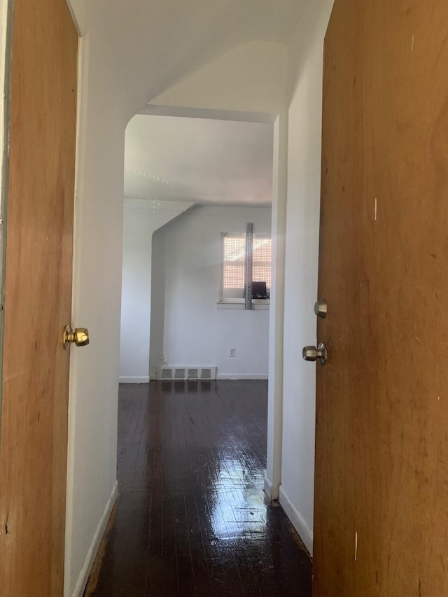 hall with dark hardwood / wood-style floors