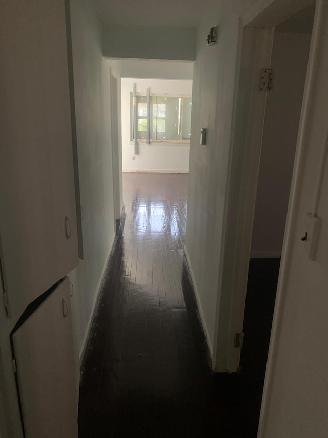 hallway featuring dark hardwood / wood-style floors