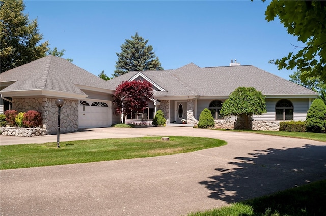 ranch-style house with a front lawn and a garage