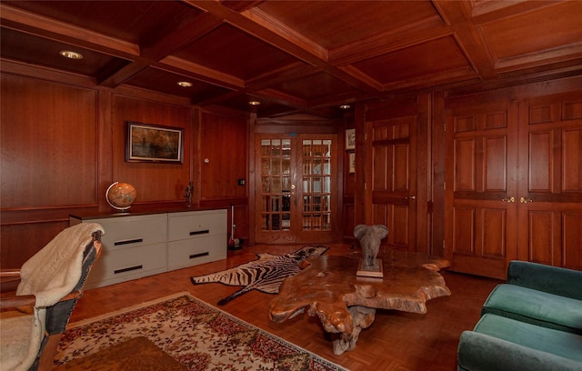 sitting room featuring wooden walls, beamed ceiling, and coffered ceiling