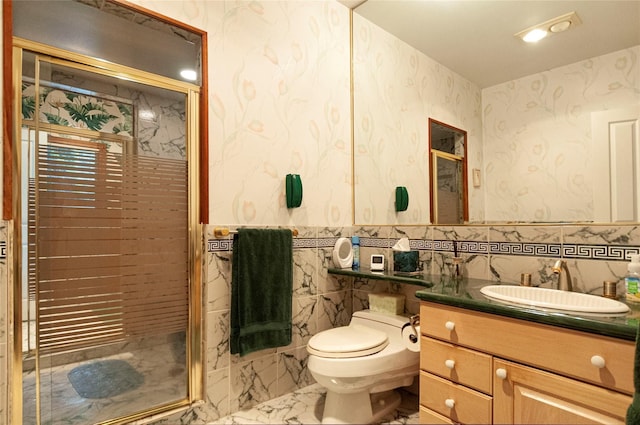 bathroom with toilet, vanity, tile walls, and walk in shower