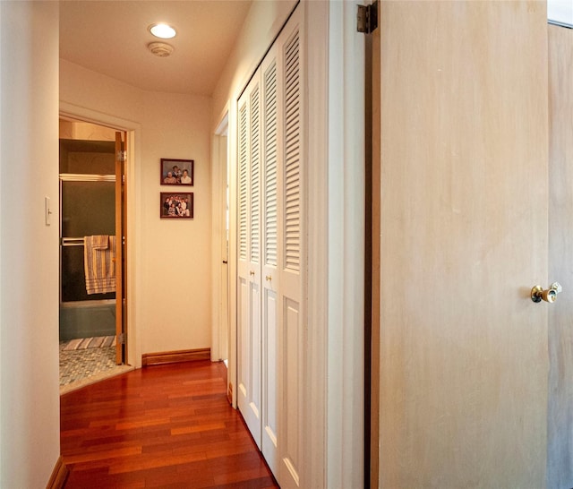 corridor featuring dark wood-type flooring