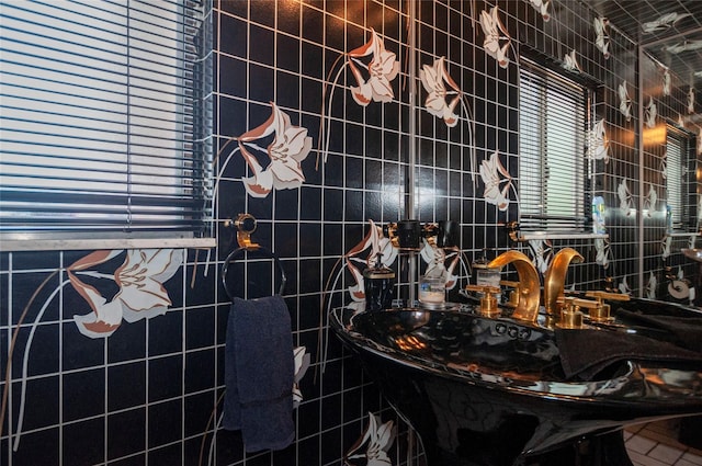 bathroom with tile walls