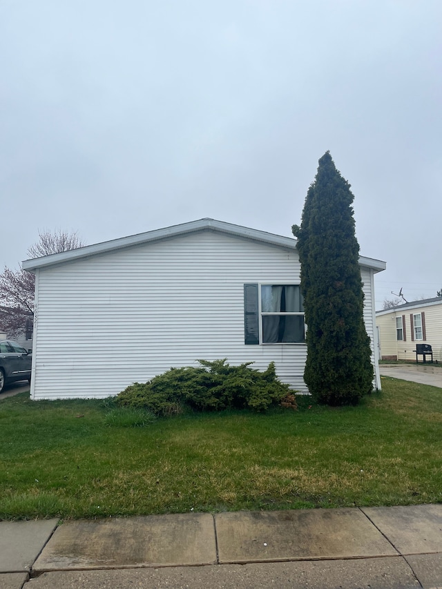 view of property exterior featuring a yard