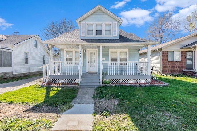 bungalow-style house featuring a front lawn and covered porch