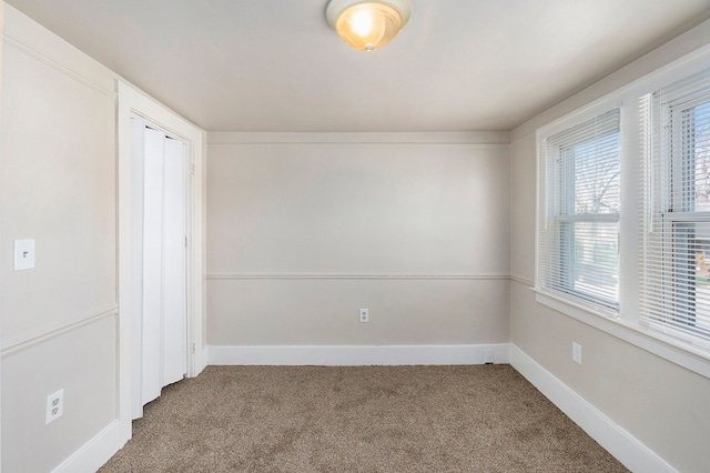 unfurnished room with carpet flooring