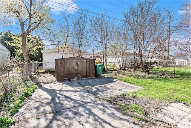 view of yard featuring a patio and a storage unit