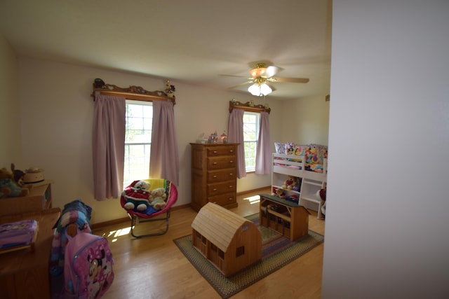 bedroom featuring light hardwood / wood-style floors and ceiling fan