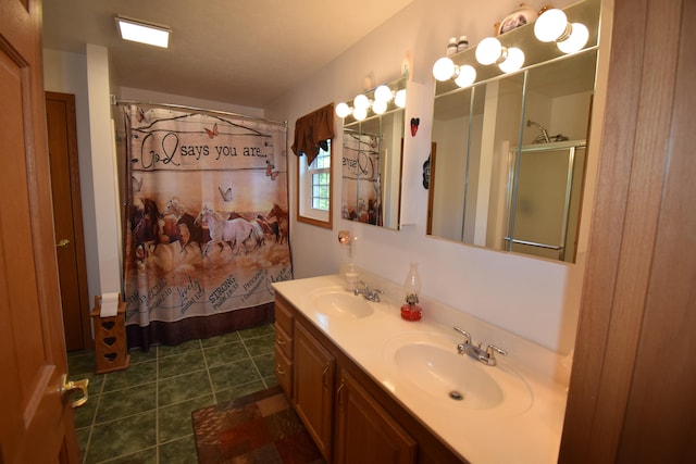 bathroom with a shower with curtain, vanity, and tile patterned floors