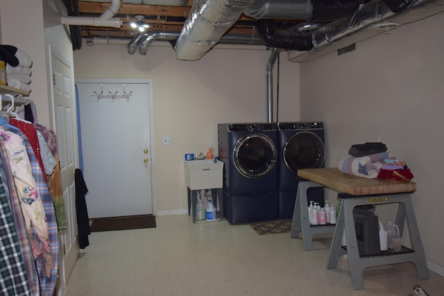 laundry area with washing machine and clothes dryer