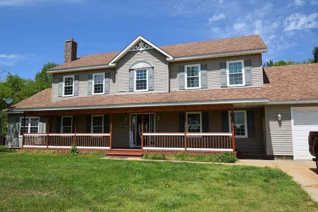 view of front facade with a porch, a garage, and a front lawn