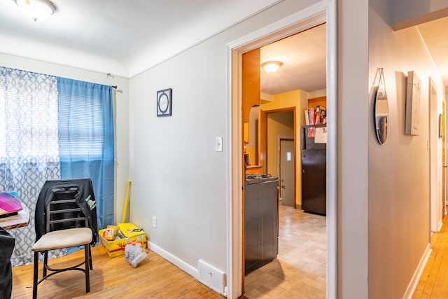 living area with light hardwood / wood-style flooring