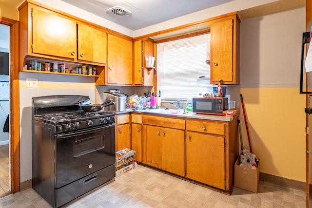 kitchen with sink and black appliances