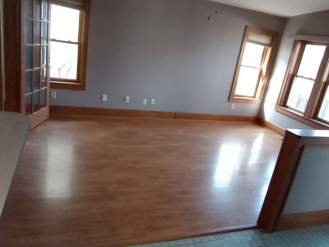 unfurnished room with light wood-type flooring