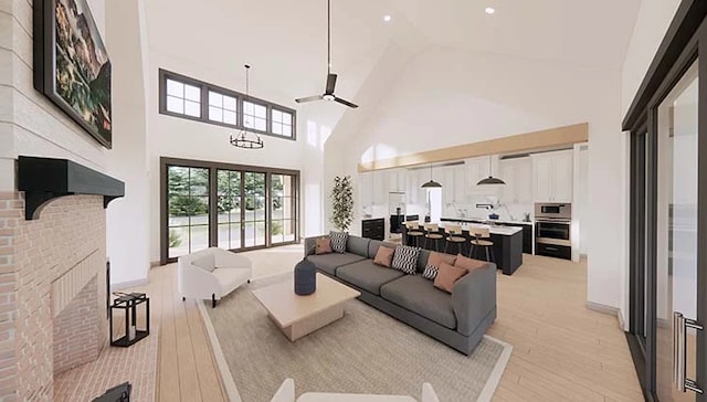 living room featuring ceiling fan, light hardwood / wood-style floors, and high vaulted ceiling