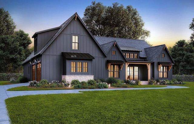 modern farmhouse style home with a yard