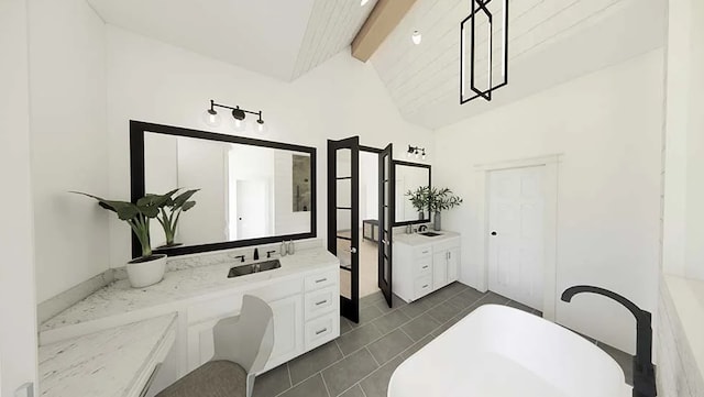 bathroom featuring vaulted ceiling with beams, tile patterned flooring, vanity, and a washtub