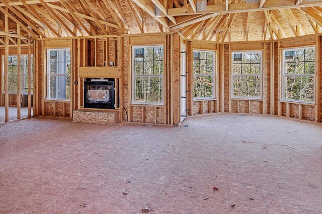 12258 Tullymore Dr, Stanwood, MI 49346 - unfurnished living room featuring a glass covered fireplace