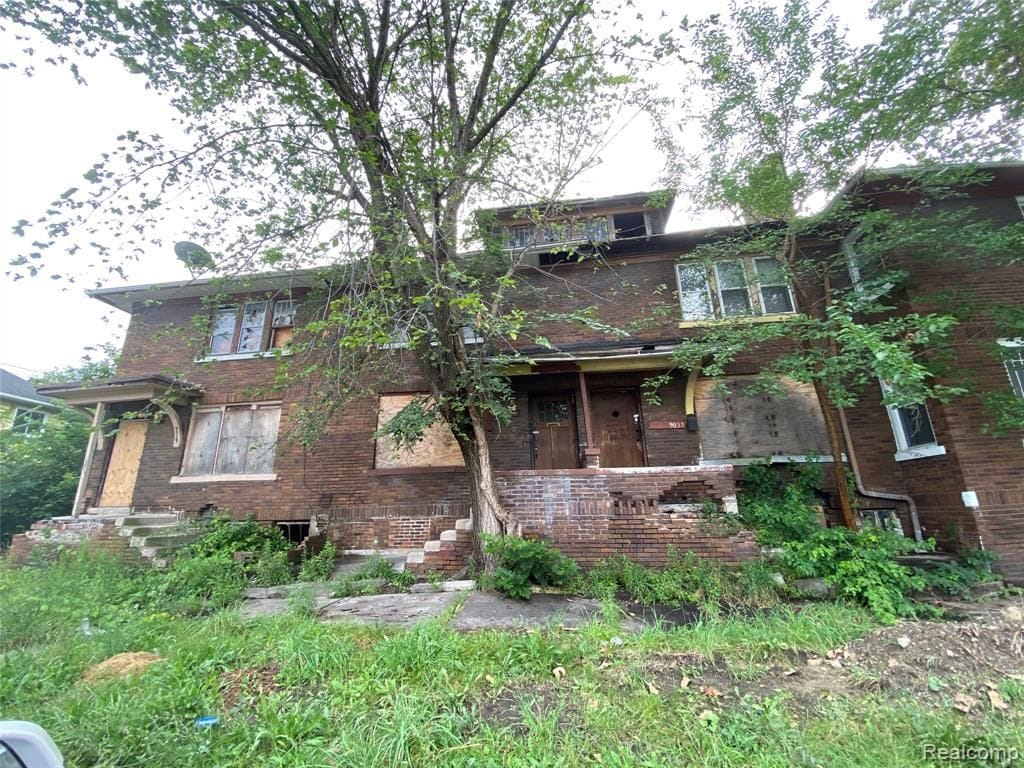 9033 Lawton St, Detroit, MI 48206 - view of front of home featuring brick siding and stairway