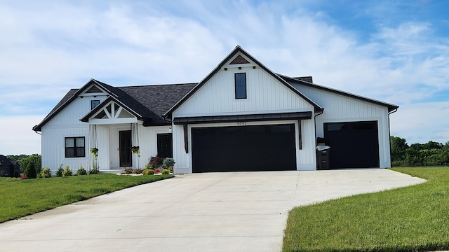 modern farmhouse style home with a garage and a front lawn