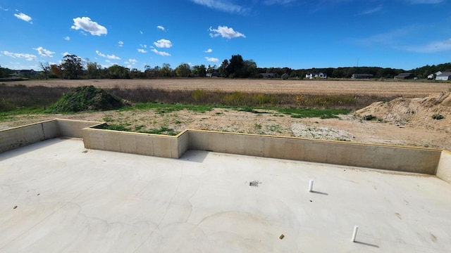 view of patio / terrace with a rural view