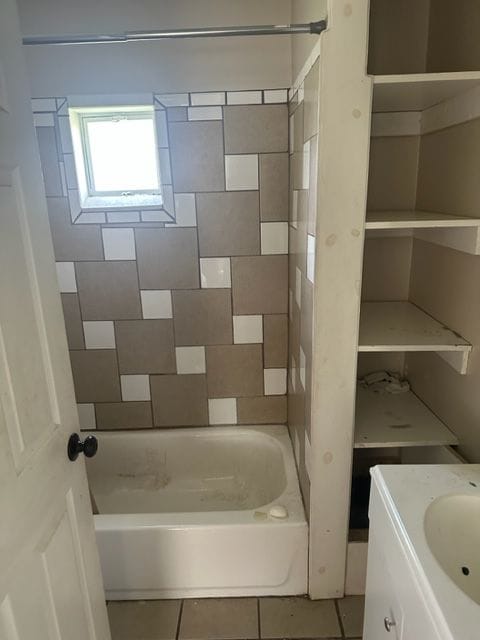 bathroom with tile patterned flooring, vanity, and shower / bathtub combination