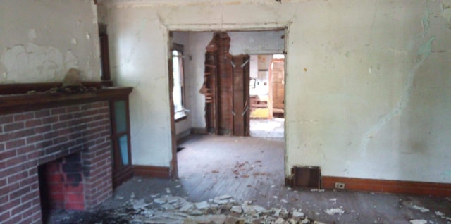 interior space featuring a brick fireplace