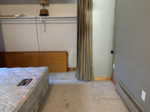 412 N Darling Ave, Fremont, MI 49412 - bedroom featuring baseboard heating and light colored carpet