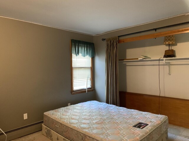412 N Darling Ave, Fremont, MI 49412 - bedroom featuring a baseboard radiator