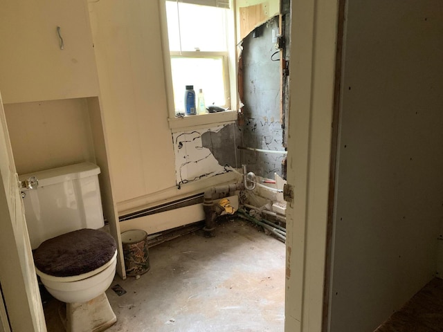 bathroom featuring concrete flooring and toilet