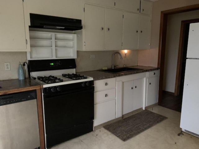 412 N Darling Ave, Fremont, MI 49412 - kitchen featuring gas range oven, extractor fan, stainless steel dishwasher, a sink, and freestanding refrigerator