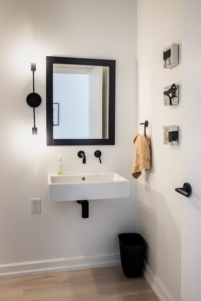 bathroom with sink and wood-type flooring