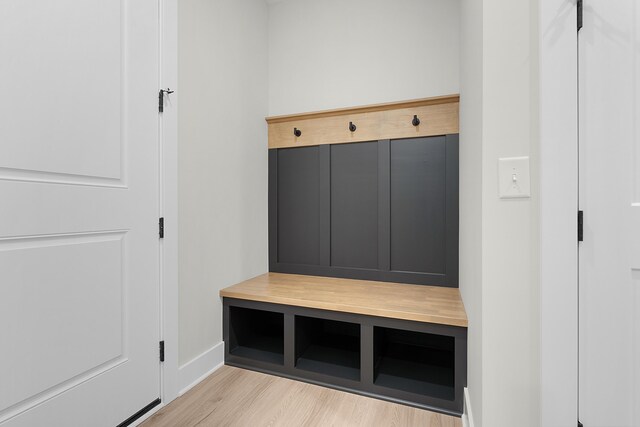 mudroom with light hardwood / wood-style floors