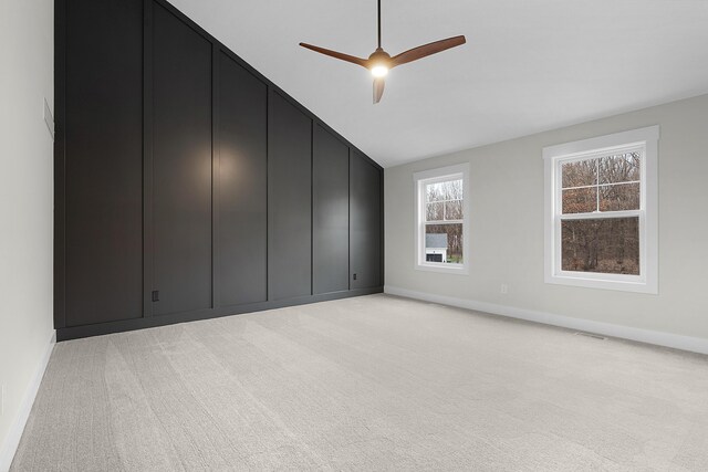 unfurnished bedroom featuring ceiling fan and light colored carpet