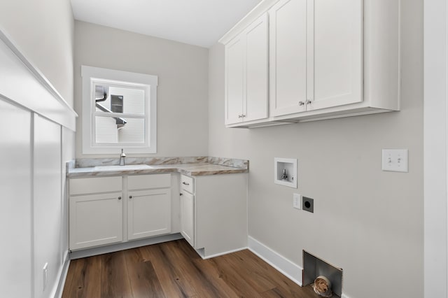 clothes washing area with dark wood-type flooring, washer hookup, a sink, cabinet space, and electric dryer hookup