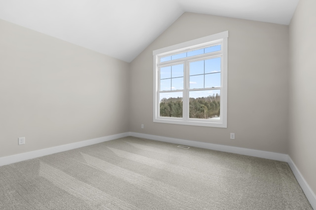 bonus room with carpet, visible vents, baseboards, and vaulted ceiling