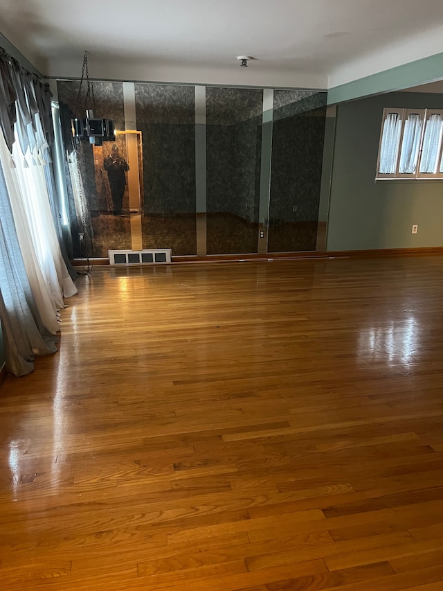 unfurnished room featuring hardwood / wood-style floors